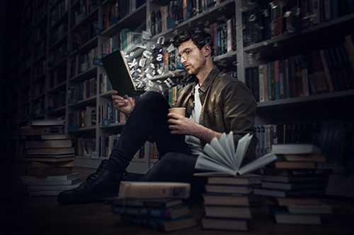 Boy reads a book in a library. Concept of curiosity, imagination and culture Boy reads a book in a library. Concept of curiosity, imagination and culture